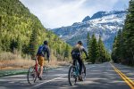 Cycling Going to the Sun Road in the Spring is an incredible way to experience the beauty of Glacier National Park.